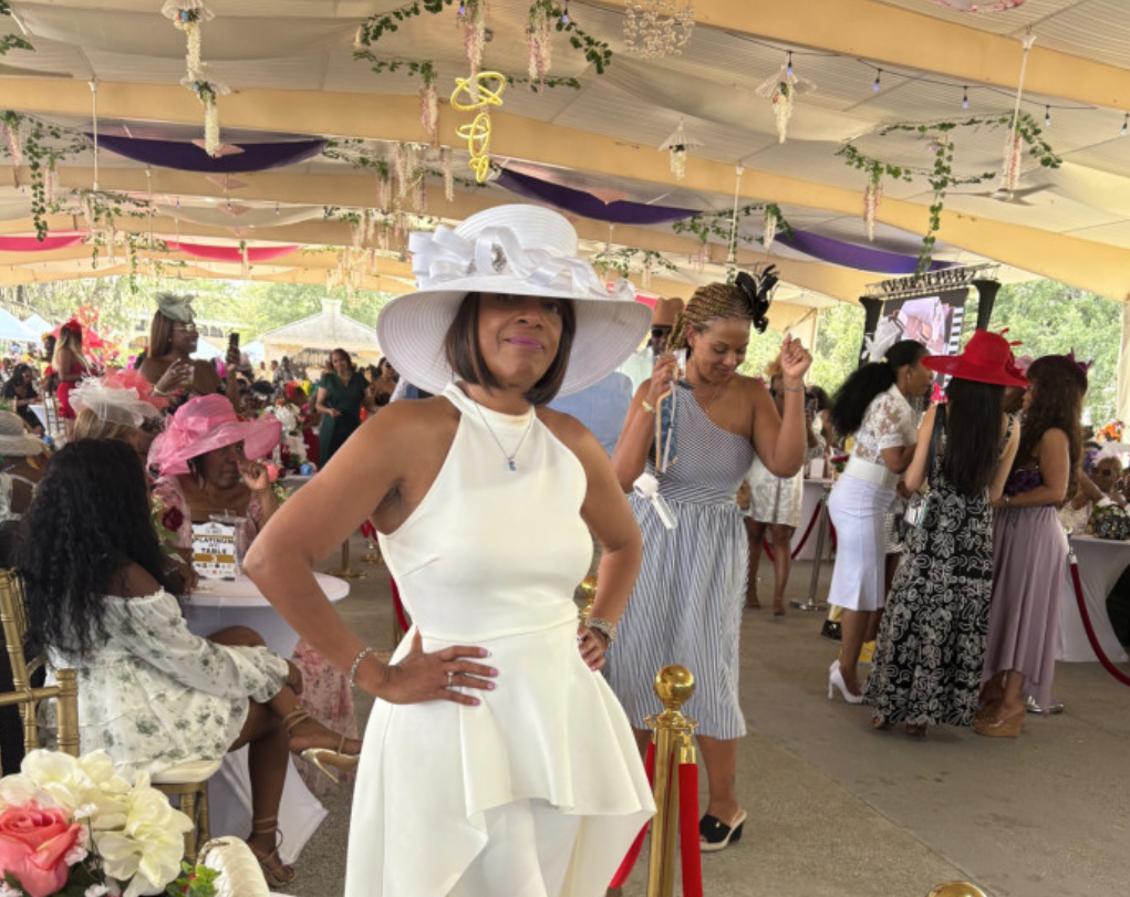 Movie producer Marcia Deans standing by a decorated table